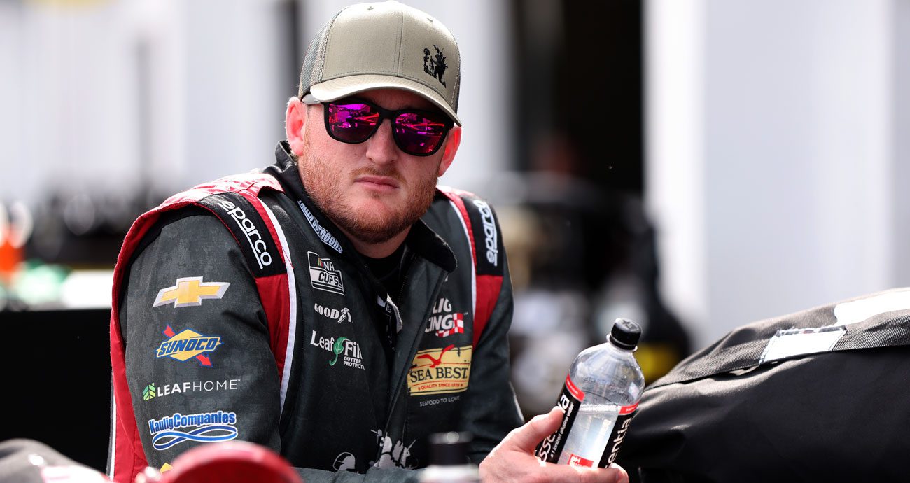 Ty Dillon looks on.