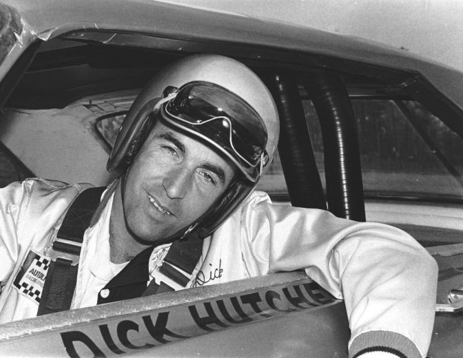 Dick Hutcherson smiles as he pokes his head out the window of car.
