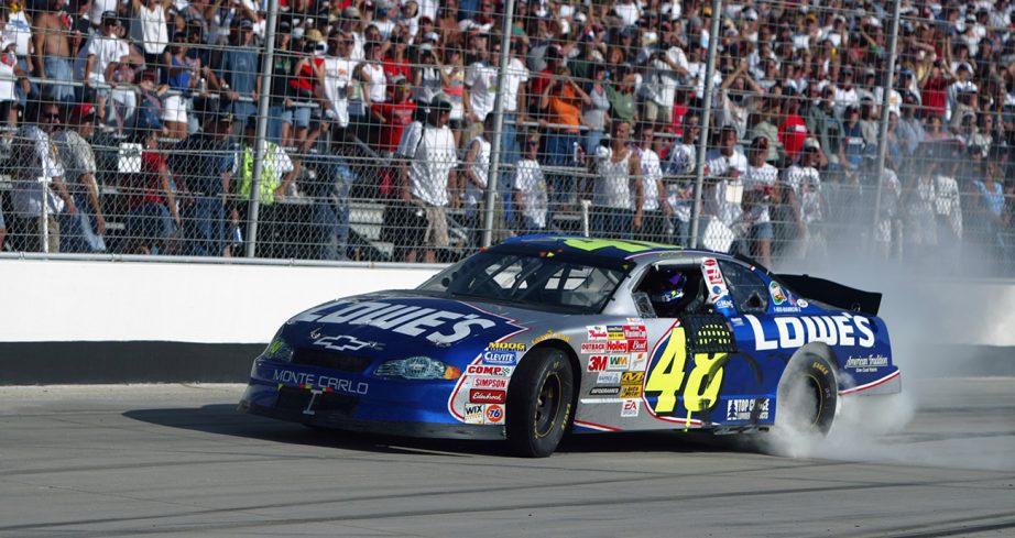 Jimmie Johnson does in No. 48 Lowe's car burnout at Dover Motor Speedway with crowd on looking.