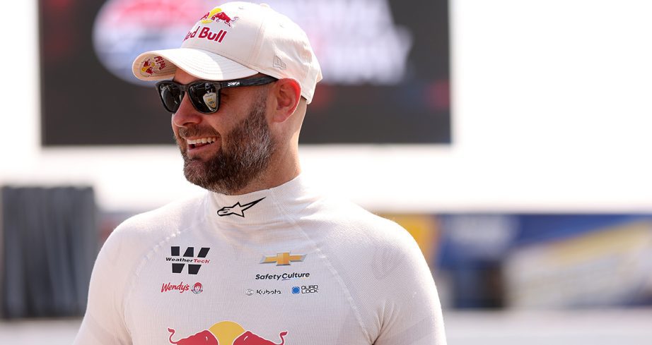 Shane van Gisbergen looks on.