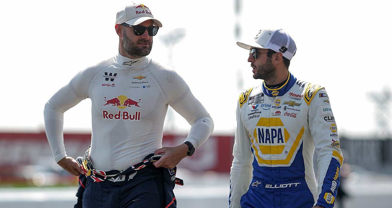 Shane van Gisbergen, left, and Chase Elliott chat on the practice and qualifying grid at Sonoma Raceway