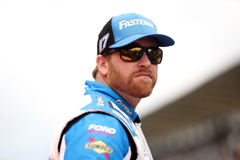 Chris Buescher looks on.