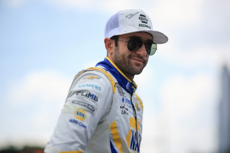 Chase Elliott looks on.