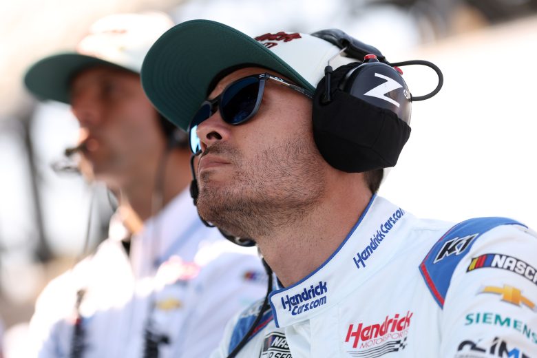 Kyle Larson looks on.