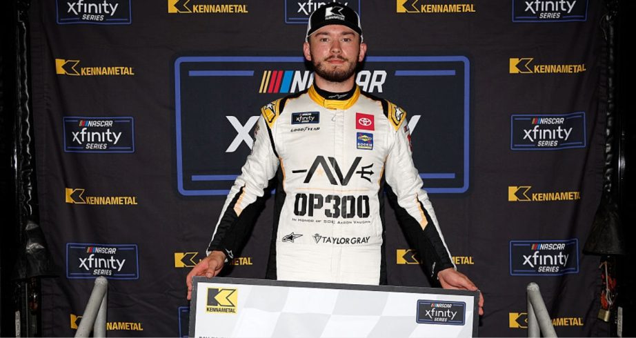 Taylor Gray celebrates after winning the pole at Dover.