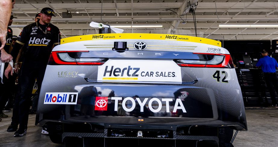 Legacy Motor Club crew members inspect the No. 42 Toyota before the Cup Series at Dover.