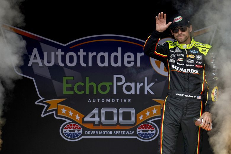 Ryan Blaney, driver of the No. 12 Menards/Libman Ford, waves to fans as he walks onstage during driver intros.