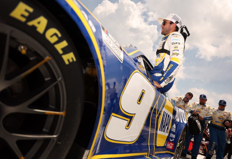 Chase Elliott climbs into his car at Dover.