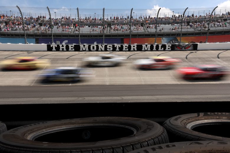 View of cars racing in front of the 