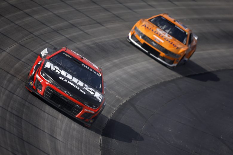 Ross Chastain races ahead of Austin Cindric at Dover.