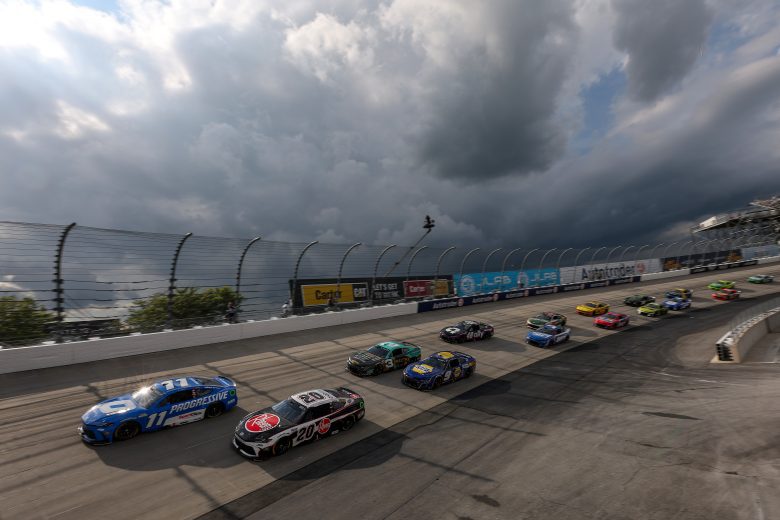 Rain clouds loom during a brief caution for weather at Dover Motor Speedway.