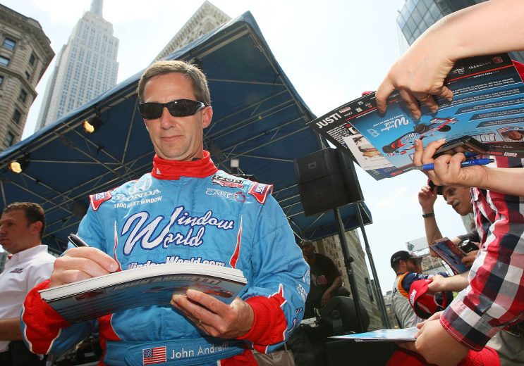 John Andretti signs autographs.