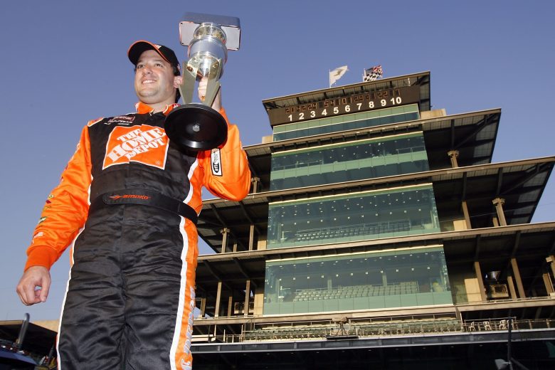 Tony Stewart holds up Brickyard 400 trophy.