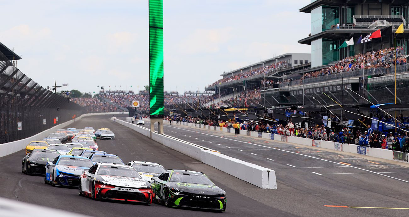 NASCAR Cup Series cars race at Indianapolis Motor Speedway.