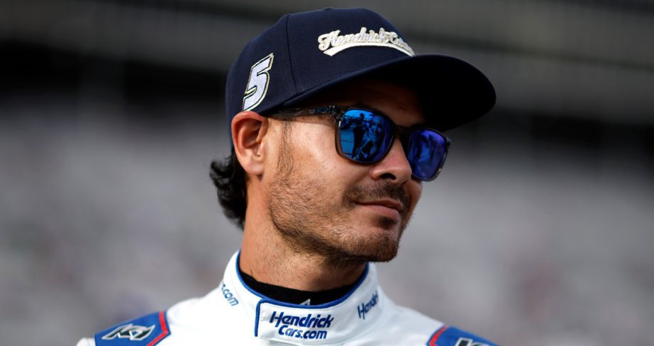 Kyle Larson looks on.