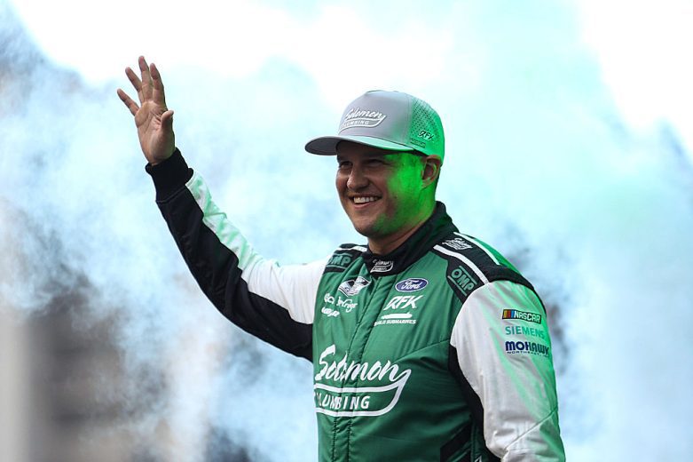 Ryan Preece waves to fans.