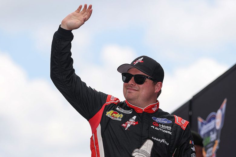 Cole Custer waves to fans.