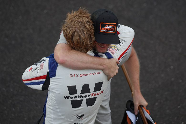Connor Zilisch and Dale Earnhardt Jr. hug at Indianapolis.