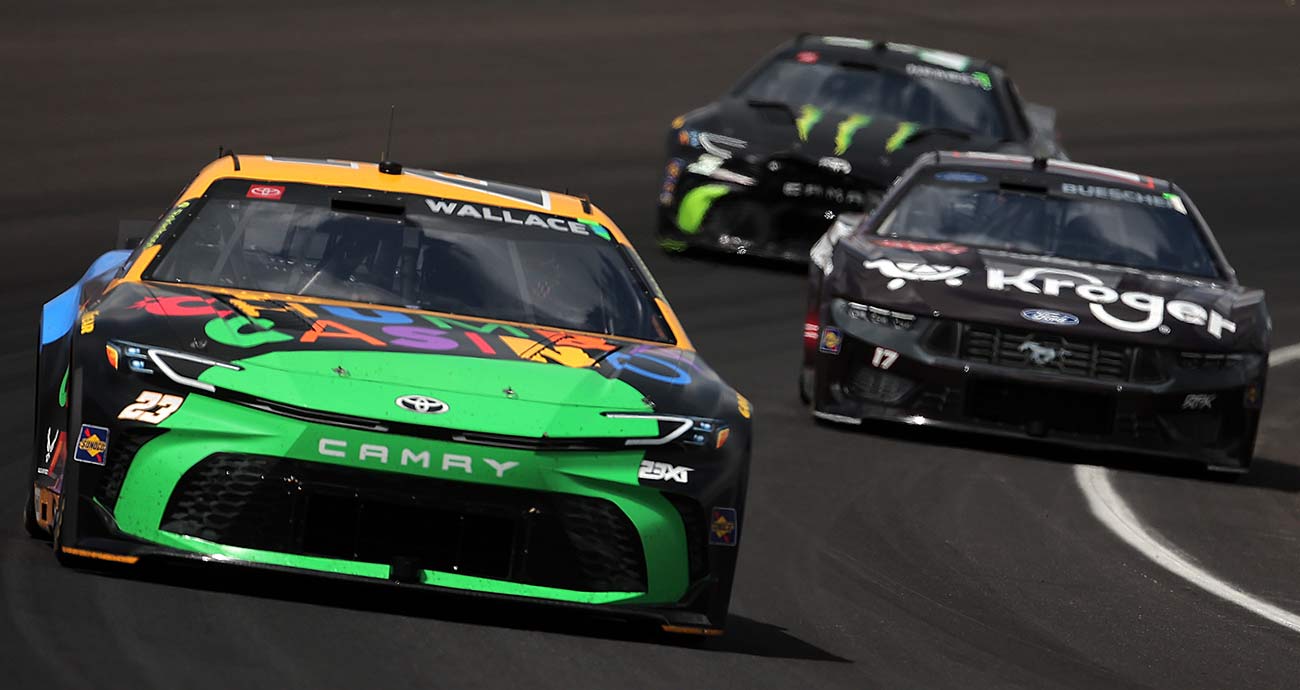 Bubba Wallace leads Chris Buescher at Indianapolis Motor Speedway