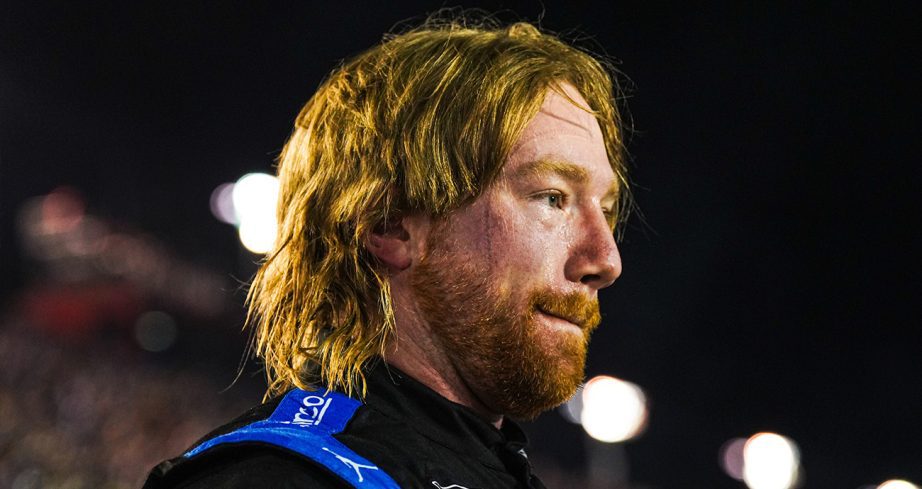Tyler Reddick looks on.