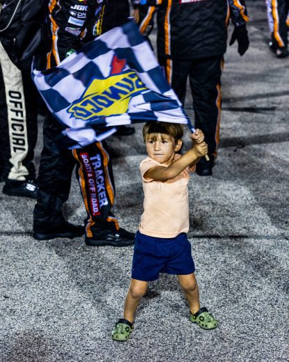 Brooks Briscoe waves a flag.