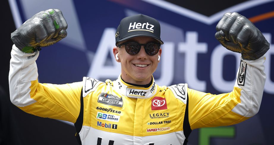 John Hunter Nemechek flexes muscles and wears Monster fists.
