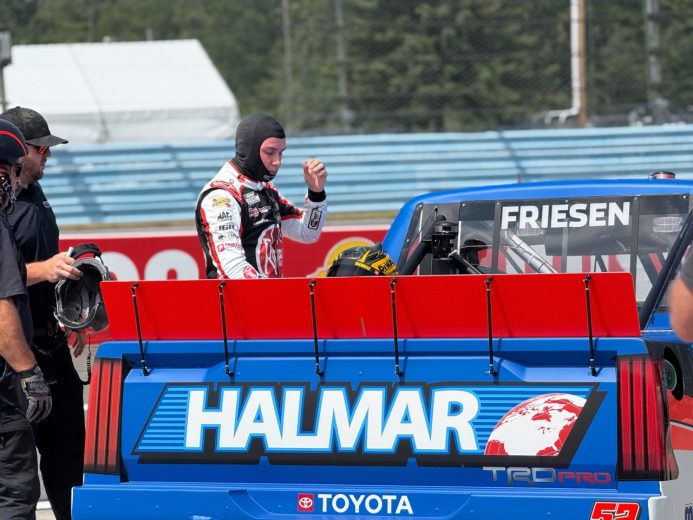 Christopher Bell stands next to the No. 52 truck at Watkins Glen International.