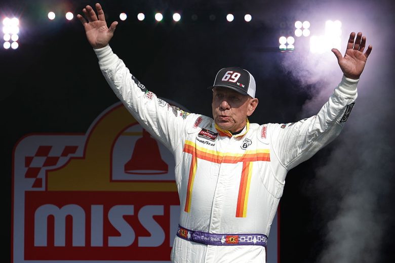 Derek White waves to the crowd before a NASCAR Craftsman Truck Series race at Watkins Glen International.