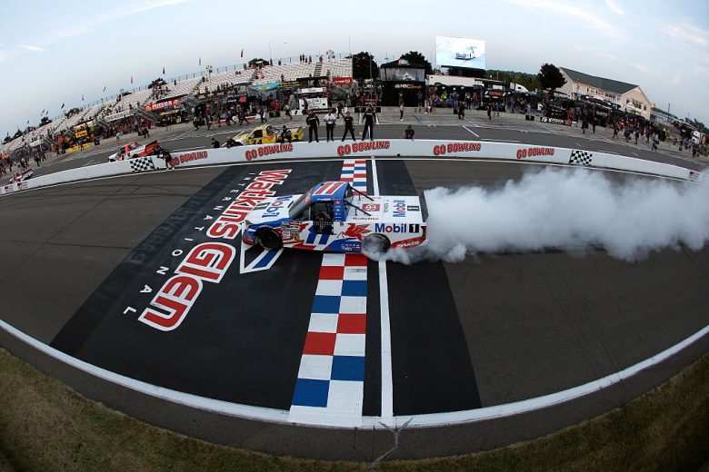Corey Heim's No. 11 Tricon Garage Toyota does a celebratory burnout following his NASCAR Craftsman Truck Series win at Watkins Glen International.