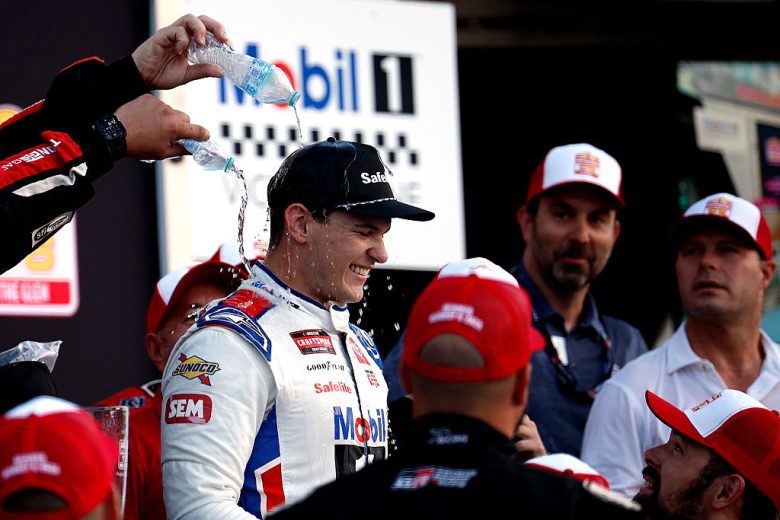 No. 11 Tricon Garage crew members pour water on race winner Corey Heim following his NASCAR Craftsman Truck Series win at Watkins Glen International.