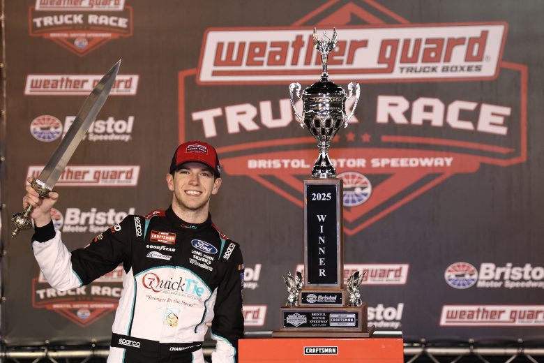 Chandler Smith poses for a photo in Victory Lane following his NASCAR Craftsman Truck Series win at Bristol Motor Speedway.