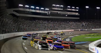 Grant Enfinger, driver of the No. 9 Grant County Mulch Chevrolet, and Christian Eckes, driver of the No. 19 Instacoat Premium Products Chevrolet, race during the NASCAR Craftsman Truck Series Clean Harbors 250 at Richmond Raceway on Aug. 10, 2024 in Richmond, Virginia.