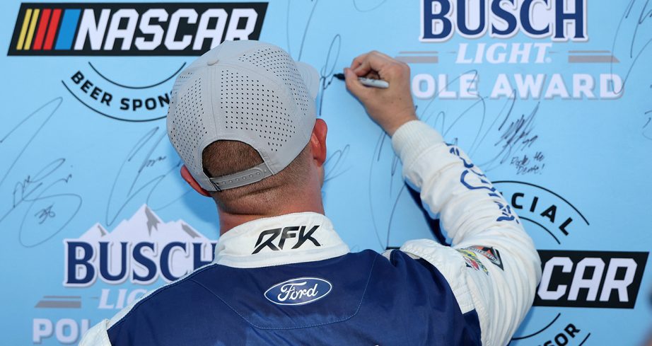 ryan preece signs the pole board after earning the top spot for saturday's cup series race at richmond