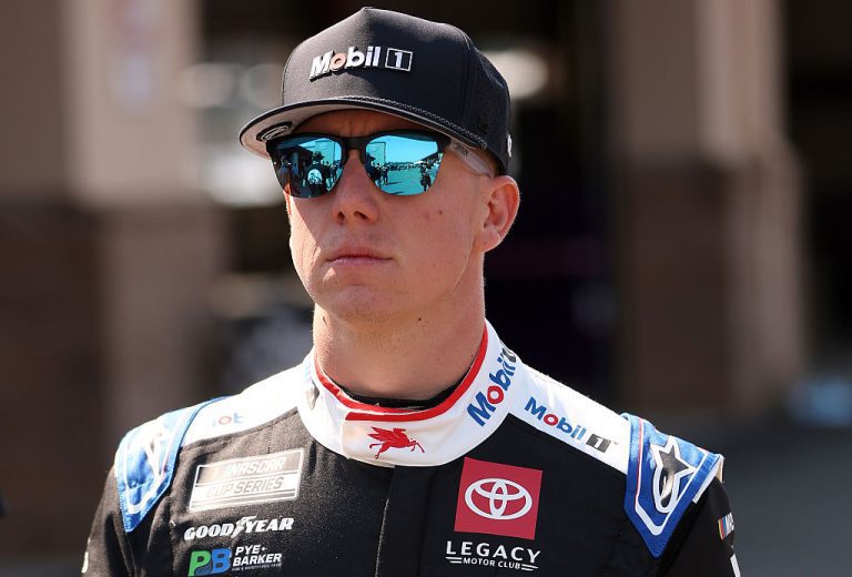 John Hunter Nemechek looks on.