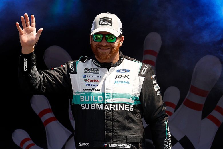 Chris Buescher waves to fans.