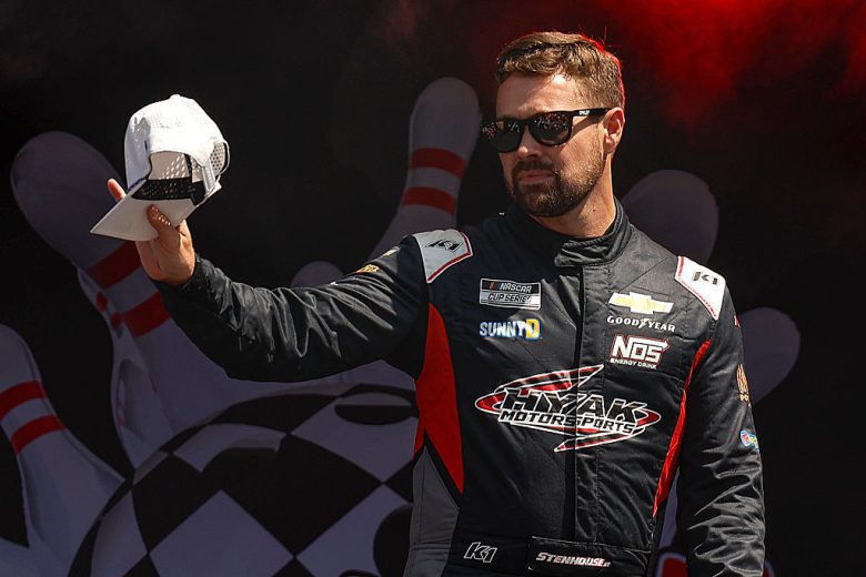 Ricky Stenhouse Jr. waves to fans.