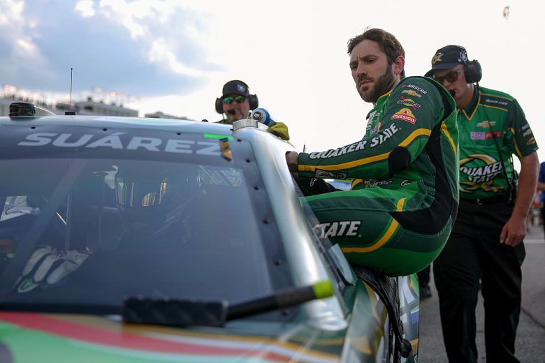 Daniel Suárez enters his car at Richmond.