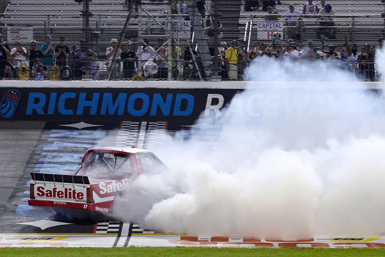 Corey Heim celebrates with a burnout after winning at Richmond.