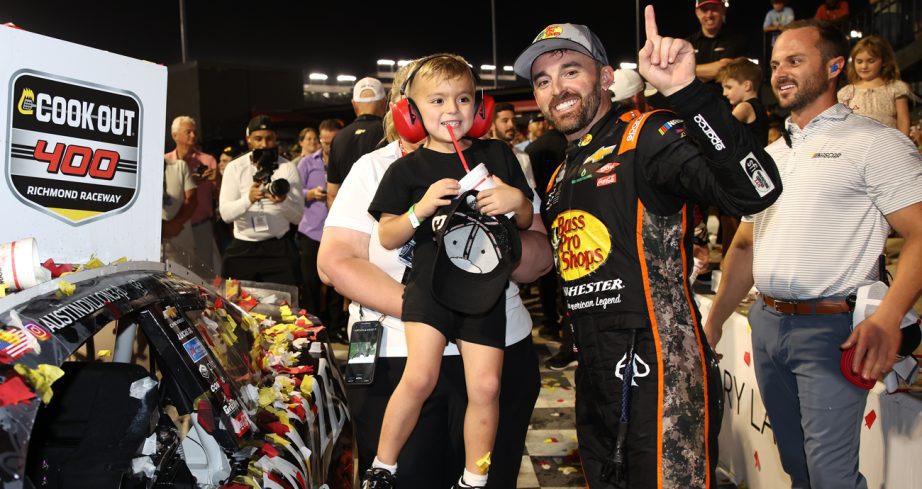 Austin Dillon and his son, Ace R.C Dillon, pose with the winner sticker on his car in Victory Lane after winning the NASCAR Cup Series Cook Out 400 at Richmond Raceway on Aug. 16, 2025 in Richmond, Virginia.