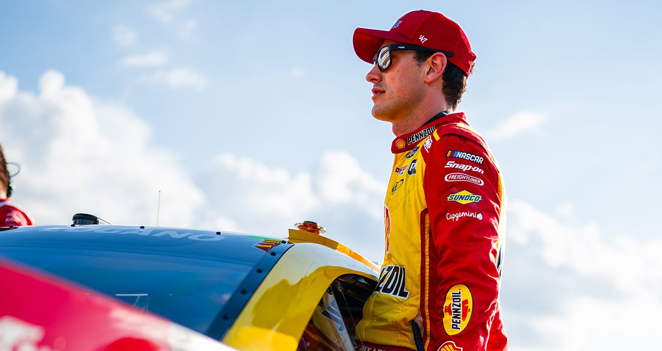 Joey Logano climbs into Ford at Richmond.