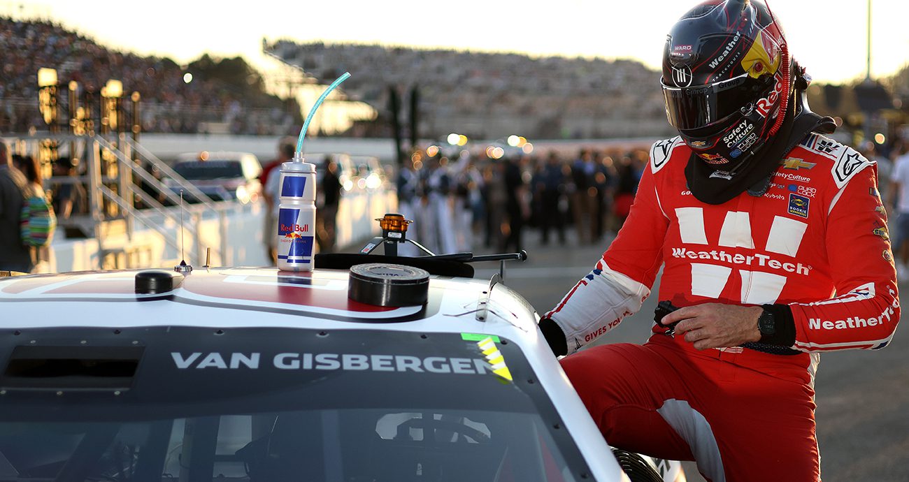 Shane van Gisbergen climbs into car.