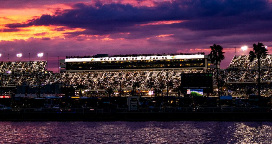 The sun sets behind Daytona International Speedway.
