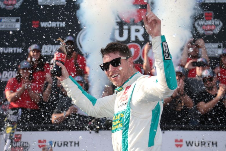 Denny Hamlin celebrates in Victory Lane.