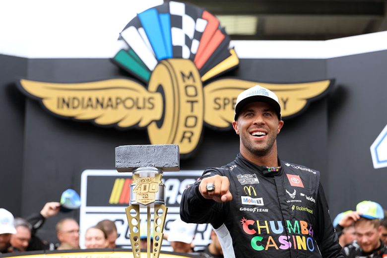 Bubba Wallace celebrates in Victory Lane.
