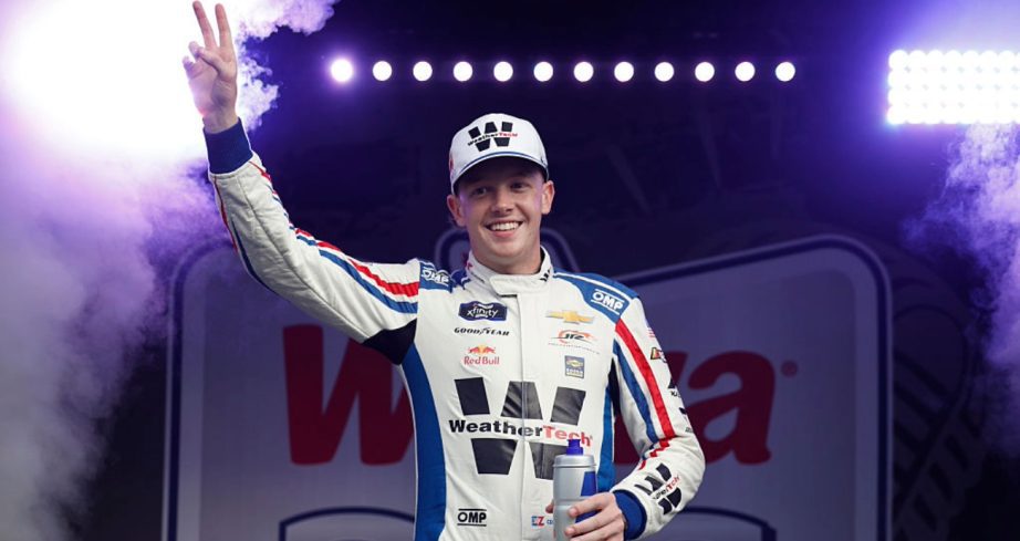 Connor Zilisch waves to fans at Daytona.
