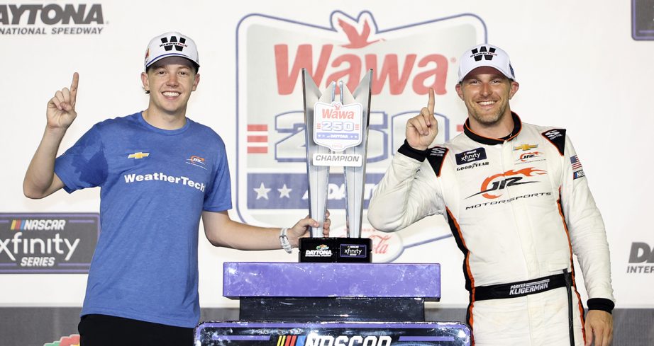 Connor Zilisch stands in Victory Lane with Parker Kligerman.