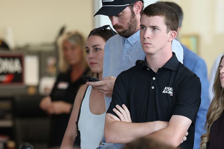 Daniel Dye looks on.