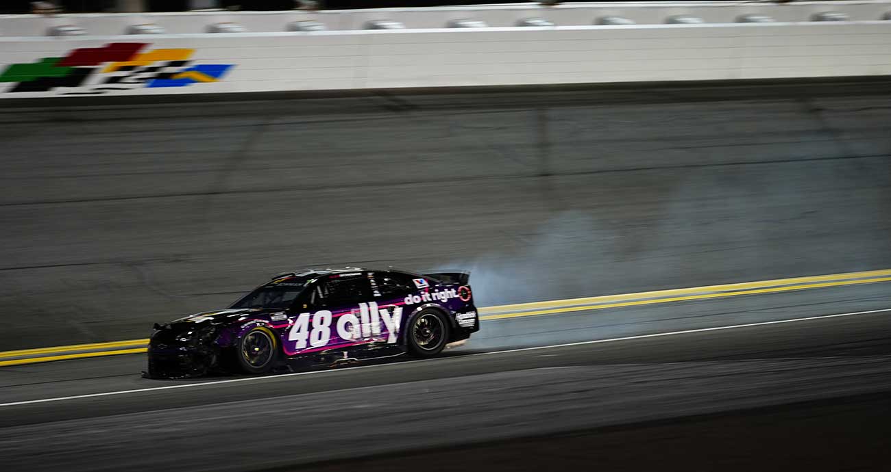 Alex Bowman's No. 48 Chevy spews smoke after a Stage 1 crash at Daytona International Speedway