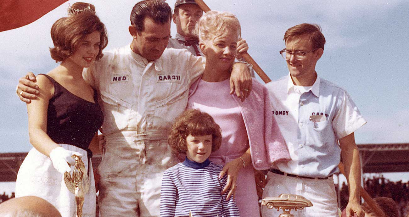 Ned Jarrett enjoys Victory Lane at Darlington Raceway with his family and car owner Bondy Long (at right) after winning the Southern 500 by 14 laps in 1965.