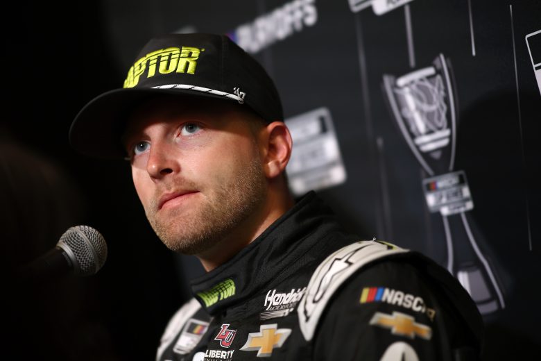 William Byron looks on during media interviews.